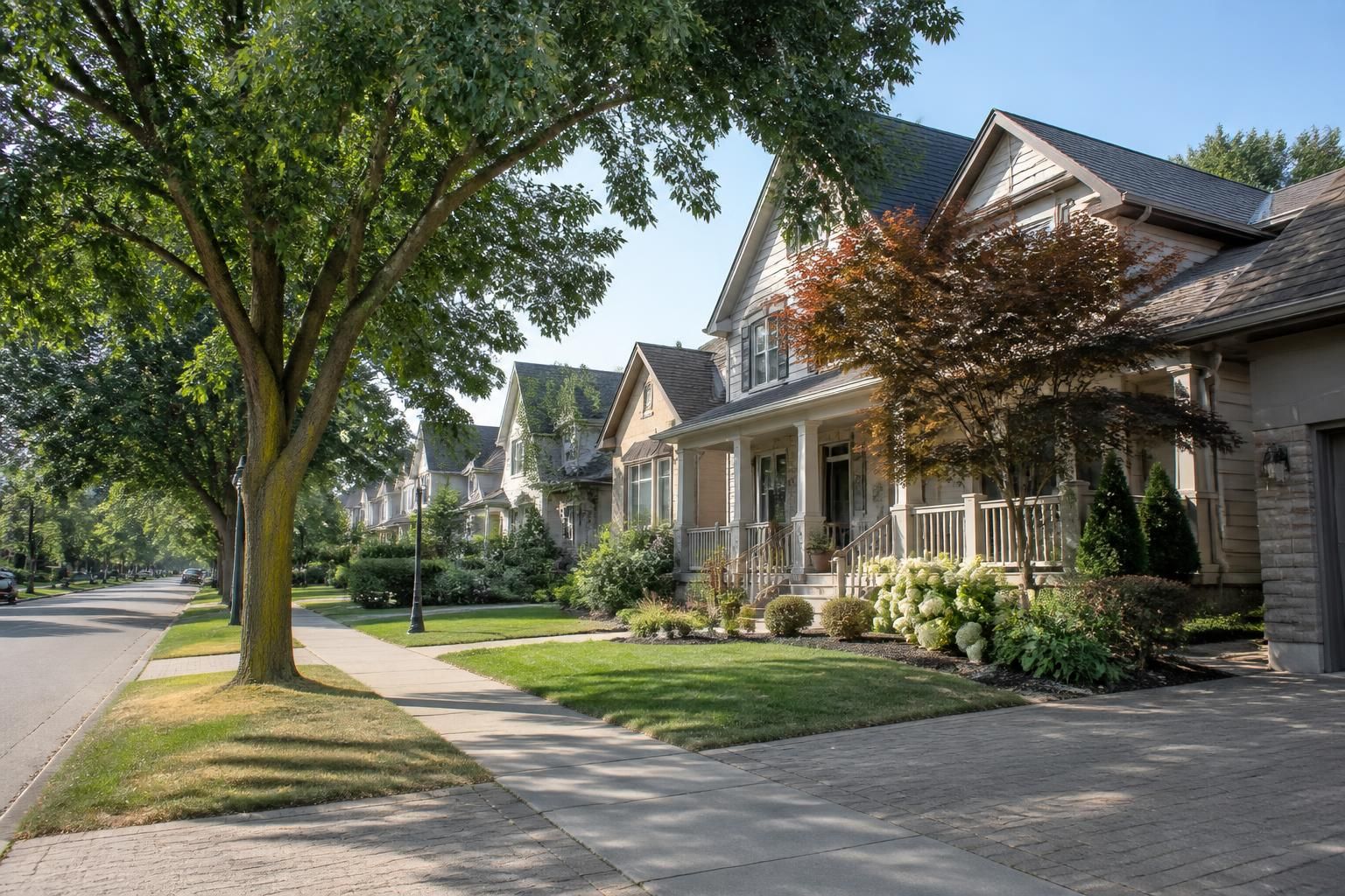 Tidy suburban street with homes in Tecumseh, Ontario.